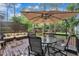 Outdoor patio featuring a large umbrella, outdoor furniture, and a gazebo in the background at 7917 Featherstone Dr, Raleigh, NC 27615
