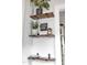 Stylish shelves with plants and decor create an aesthetically pleasing and functional display in the home at 7917 Featherstone Dr, Raleigh, NC 27615