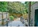 Private backyard with patio area, mature trees, and privacy fence; perfect for outdoor entertaining at 875 Martin Luther King Jr Blvd # 7, Chapel Hill, NC 27514