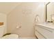Charming half bath features a modern vanity, decorative mirror, and stylish wall decor at 875 Martin Luther King Jr Blvd # 7, Chapel Hill, NC 27514