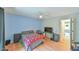 Comfortable bedroom with hardwood floors, a ceiling fan, and a workspace area at 875 Martin Luther King Jr Blvd # 7, Chapel Hill, NC 27514