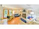 Bright living room with wood floors, fireplace, french doors to backyard, and comfortable seating at 875 Martin Luther King Jr Blvd # 7, Chapel Hill, NC 27514