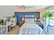 Charming main bedroom with blue accent wall, complemented by a ceiling fan and bright natural light at 875 Martin Luther King Jr Blvd # 7, Chapel Hill, NC 27514