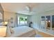 Bright main bedroom featuring hardwood floors, ceiling fan, and a large window with natural light at 875 Martin Luther King Jr Blvd # 7, Chapel Hill, NC 27514