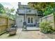 Back patio with a grill, fire pit, and upper level deck is perfect for outdoor relaxation and entertaining at 875 Martin Luther King Jr Blvd # 7, Chapel Hill, NC 27514