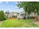 Spacious backyard features a lush lawn, mature trees, privacy fence, and view of the home at 10012 San Remo Pl, Wake Forest, NC 27587