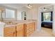 Bathroom featuring double vanities and views into the main bedroom at 10012 San Remo Pl, Wake Forest, NC 27587
