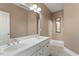 Bathroom featuring a dual-sink vanity with chrome faucets and a large mirror at 10012 San Remo Pl, Wake Forest, NC 27587