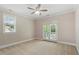 Bright bedroom features neutral walls, plush carpet, and a ceiling fan for added comfort at 10012 San Remo Pl, Wake Forest, NC 27587