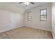 Spacious bedroom with neutral carpet, two windows, ceiling fan, and trimwork at 10012 San Remo Pl, Wake Forest, NC 27587