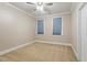 Spacious bedroom with plush carpet, two windows, and neutral walls at 10012 San Remo Pl, Wake Forest, NC 27587