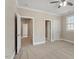 Spacious bedroom with multiple doorway access and natural light at 10012 San Remo Pl, Wake Forest, NC 27587