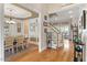 Open entryway with hardwood floors, staircase, transom windows, and dining room access that accentuates the home's layout at 10012 San Remo Pl, Wake Forest, NC 27587