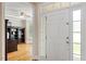 Bright entryway with a view into a living room and hardwood floors at 10012 San Remo Pl, Wake Forest, NC 27587