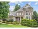 Attractive two-story home featuring brick and siding, plus well-maintained landscaping at 10012 San Remo Pl, Wake Forest, NC 27587
