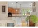 A bar overlooks the kitchen which features stainless steel appliances and granite countertops at 10012 San Remo Pl, Wake Forest, NC 27587