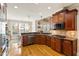 Spacious kitchen with wooden cabinets, stainless steel appliances, and bright windows at 10012 San Remo Pl, Wake Forest, NC 27587