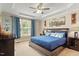 Beautiful main bedroom with blue accents, tray ceiling, and plenty of natural light at 10012 San Remo Pl, Wake Forest, NC 27587