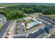 Aerial view of community featuring a pool, clubhouse, townhomes, and green spaces, designed for leisure and community interaction at 1008 Whistler St, Durham, NC 27713