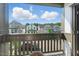 Neighborhood view from private balcony overlooking community with blue skies and landscaping at 1008 Whistler St, Durham, NC 27713