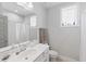 A bright bathroom has a large mirror, a walk-in shower, and a soaking tub, creating a spa-like retreat at 1008 Whistler St, Durham, NC 27713
