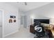 A home office has neutral-colored walls, modern lighting, and a stylish desk and chair at 1008 Whistler St, Durham, NC 27713