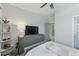 A well-lit bedroom with neutral walls, a queen-sized bed, and stylish furnishings at 1008 Whistler St, Durham, NC 27713