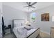 A well-lit bedroom has an abundance of natural light coming from a large window overlooking the landscape at 1008 Whistler St, Durham, NC 27713
