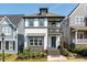 Inviting two-story home features a front porch, second-story balcony, and meticulously landscaped front yard at 1008 Whistler St, Durham, NC 27713