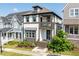 Attractive two-story home with a charming covered porch and a second-story balcony, complemented by lush landscaping at 1008 Whistler St, Durham, NC 27713