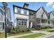 A well-maintained home boasts a charming front porch, landscaped yard, and two-story architecture at 1008 Whistler St, Durham, NC 27713
