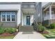 Inviting front porch with a blue door and well-kept landscaping, enhancing curb appeal at 1008 Whistler St, Durham, NC 27713