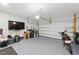 A two car garage with epoxy floors features storage and parking for motorcycles at 1008 Whistler St, Durham, NC 27713