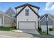 A two-car garage features a white door with easy driveway access at 1008 Whistler St, Durham, NC 27713