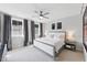 Serene bedroom with neutral tones, plush carpeting, and ample natural light from multiple windows at 1008 Whistler St, Durham, NC 27713