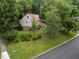 Aerial view of the landscaped house and surrounding neighborhood at 101 Joel Ct, Cary, NC 27513