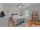 Charming bedroom featuring a plush bed, colorful rug, and natural light from a large window at 101 Joel Ct, Cary, NC 27513