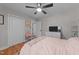 Cozy bedroom with neutral tones, featuring a comfortable bed, closet, and ample natural light at 101 Joel Ct, Cary, NC 27513