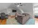 Spacious bonus room featuring a comfortable sectional sofa and play area at 101 Joel Ct, Cary, NC 27513