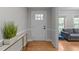 Bright foyer with wood floors, white trim, and view of the living room at 101 Joel Ct, Cary, NC 27513