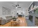Bright open-concept living room with a fireplace and view into modern kitchen at 101 Joel Ct, Cary, NC 27513