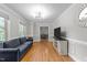 Inviting living room boasting hardwood floors, a stylish couch, and plenty of space for entertaining at 101 Joel Ct, Cary, NC 27513
