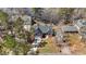 Aerial view showcases home's location within a wooded neighborhood at 1013 Sagamore Dr, Louisburg, NC 27549