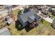 Aerial view of a gray home showing its roofline, screened-in porch and wooded backyard at 1013 Sagamore Dr, Louisburg, NC 27549