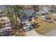 Aerial view of well-kept home with an attached two-car garage, driveway and front yard at 1013 Sagamore Dr, Louisburg, NC 27549