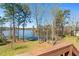 Lakeside backyard with mature trees at 1013 Sagamore Dr, Louisburg, NC 27549