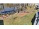 Lakeside backyard with mature trees at 1013 Sagamore Dr, Louisburg, NC 27549