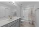 Bathroom with single vanity, tub and shower combination, and gray walls at 1013 Sagamore Dr, Louisburg, NC 27549