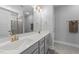Elegant bathroom featuring a double vanity, granite countertops, and modern fixtures at 1013 Sagamore Dr, Louisburg, NC 27549