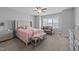 Cozy bedroom featuring a plush bed, bench, and comfortable sitting area near a bright window at 1013 Sagamore Dr, Louisburg, NC 27549